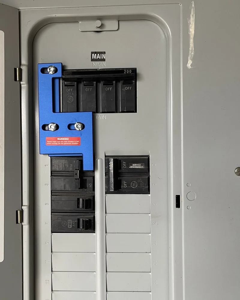 Newly installed breaker panel with a 200-amp main breaker and neatly labeled blank spaces